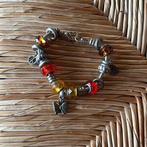 Elegant Silver and Red Charm Bracelet Peace sign, butterfly.